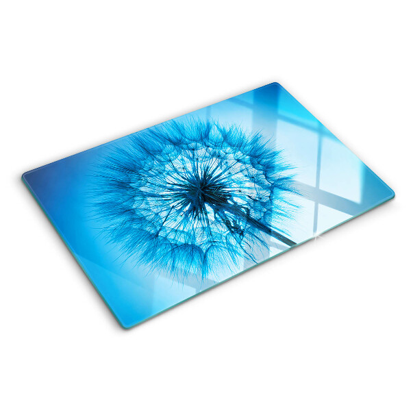 Tabla de cortar de cristal Diente de león sobre fondo azul