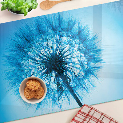 Tabla de cortar de cristal Diente de león sobre fondo azul