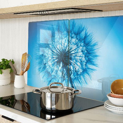 Tabla de cortar de cristal Diente de león sobre fondo azul