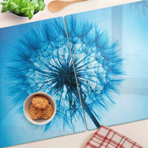 Tabla de cortar de cristal Diente de león sobre fondo azul