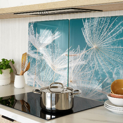 Tabla de cocina Dientes de león sobre un fondo azul