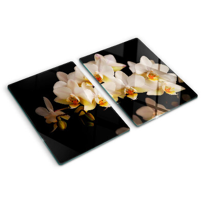 Tabla de cortar de cristal Orquídeas sobre fondo negro