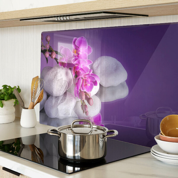 Deska kuchenna szklana Kwiaty orchidei na tle kamieni