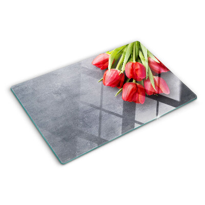 Tabla para cortar Tulipanes sobre un fondo gris