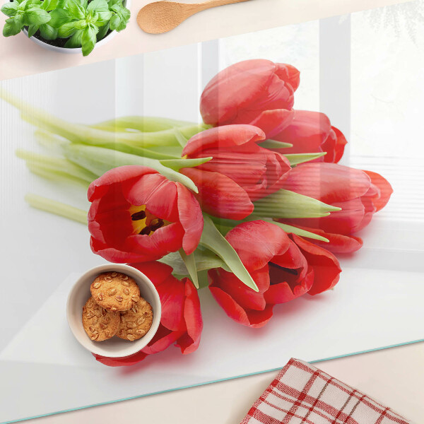 Tabla de cortar de cristal Tulipanes rojos sobre fondo blanco