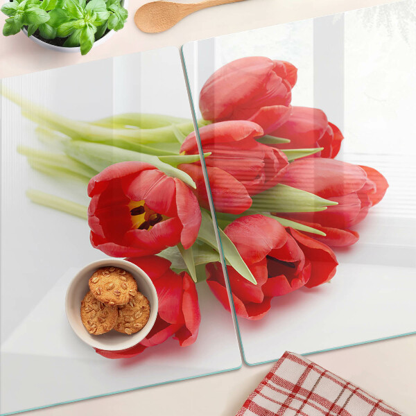 Tabla de cortar de cristal Tulipanes rojos sobre fondo blanco