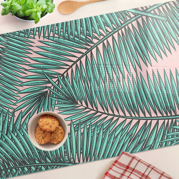 Tabla de cortar Hojas de palma sobre fondo rosa