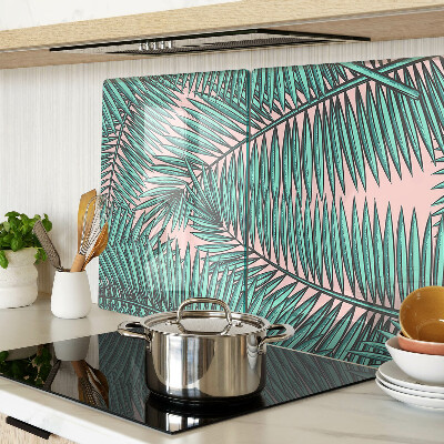 Tabla de cortar Hojas de palma sobre fondo rosa