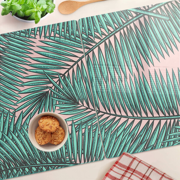 Tabla de cortar Hojas de palma sobre fondo rosa