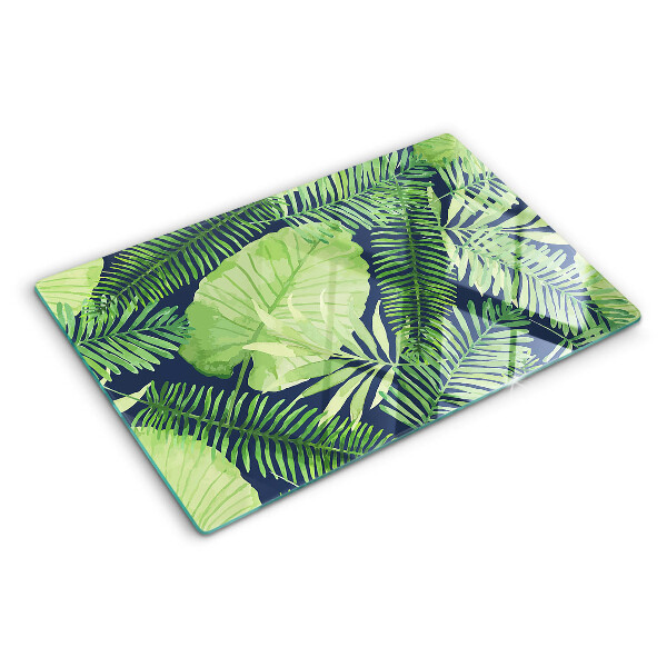 Tabla de cocina Hojas tropicales sobre un fondo oscuro.