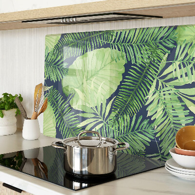 Tabla de cocina Hojas tropicales sobre un fondo oscuro.