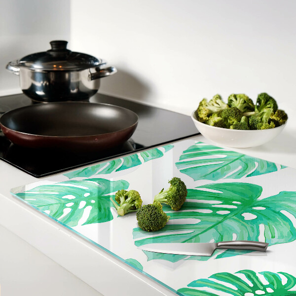 Tabla de cortar Hojas de monstera sobre fondo blanco