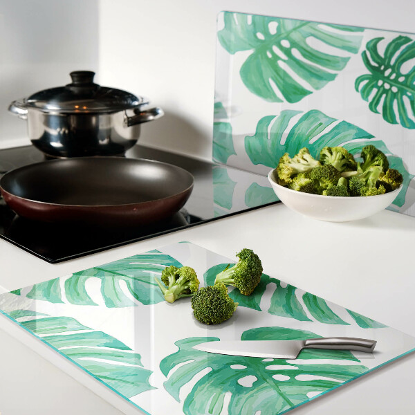 Tabla de cortar Hojas de monstera sobre fondo blanco