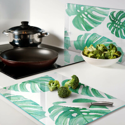 Tabla de cortar Hojas de monstera sobre fondo blanco