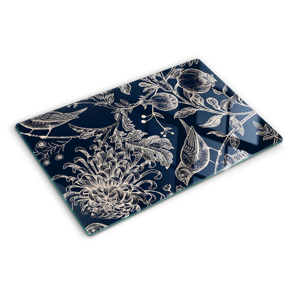 Tabla de cortar Flores y pájaros sobre un fondo oscuro.