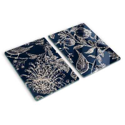 Tabla de cortar Flores y pájaros sobre un fondo oscuro.