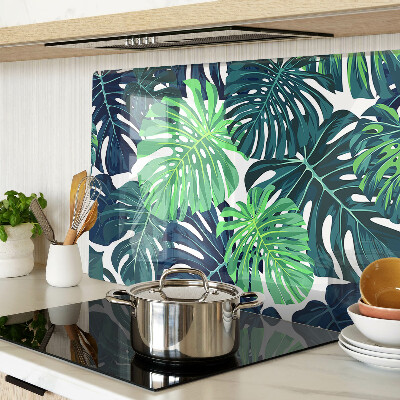 Tabla de cocina Hojas de monstera sobre un fondo tropical.