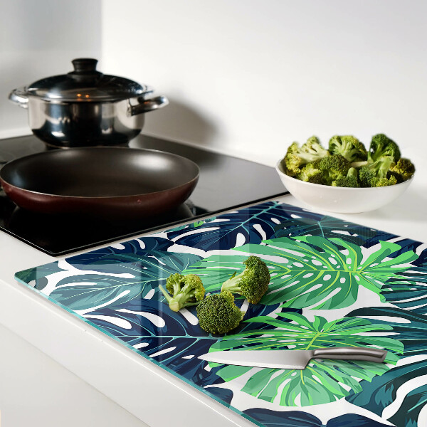 Tabla de cocina Hojas de monstera sobre un fondo tropical.