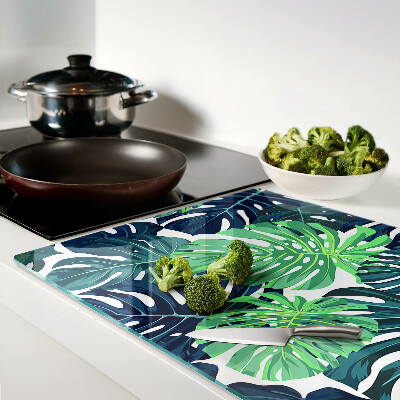 Tabla de cocina Hojas de monstera sobre un fondo tropical.
