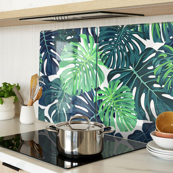 Tabla de cocina Hojas de monstera sobre un fondo tropical.