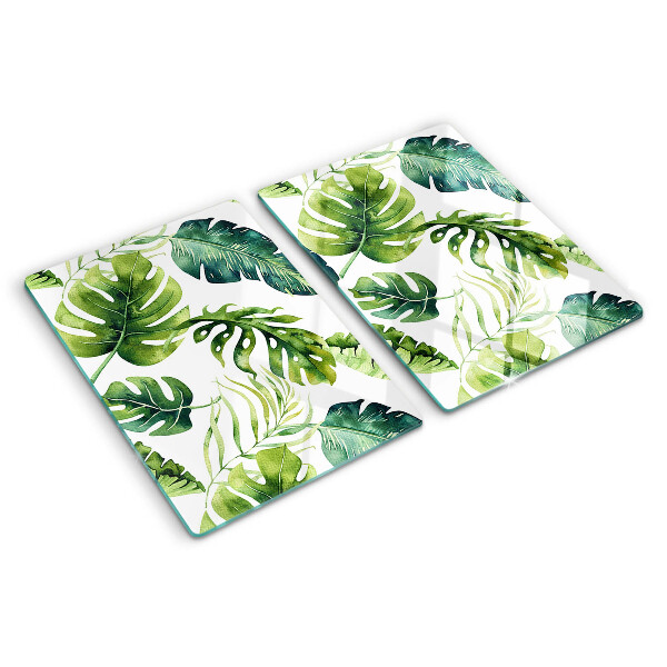 Tabla de cortar de cristal Hojas de monstera en tonos verdes.