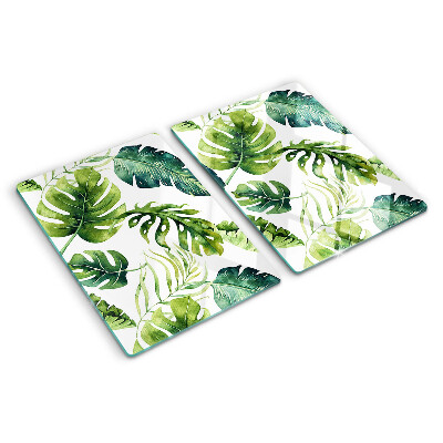 Tabla de cortar de cristal Hojas de monstera en tonos verdes.