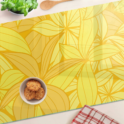 Tabla de cocina Hojas amarillas en estilo tropical.