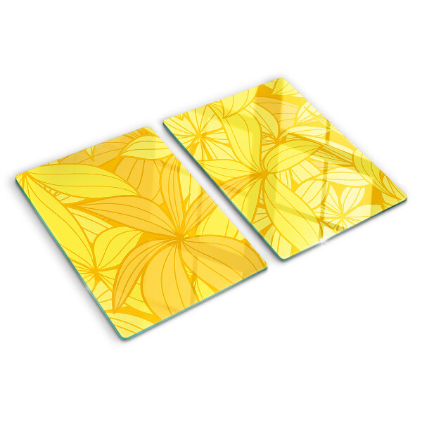 Tabla de cocina Hojas amarillas en estilo tropical.