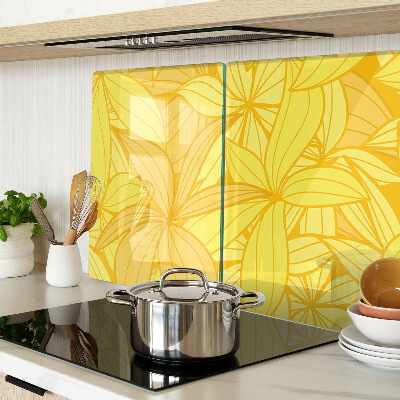 Tabla de cocina Hojas amarillas en estilo tropical.