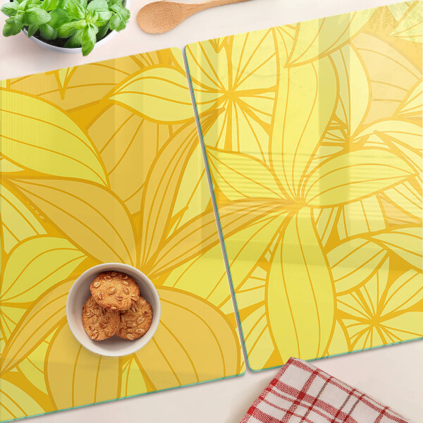 Tabla de cocina Hojas amarillas en estilo tropical.