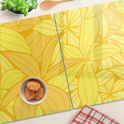 Tabla de cocina Hojas amarillas en estilo tropical.