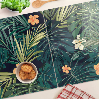 Tabla de cortar de cristal Patrón tropical con hojas y flores.
