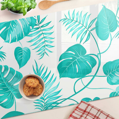 Tabla para cortar Hojas tropicales en tonos verdes.