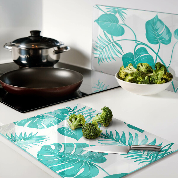 Tabla para cortar Hojas tropicales en tonos verdes.