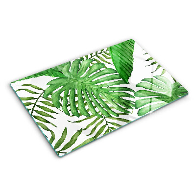 Tabla de cortar de cristal Hojas tropicales en tonos verdes.