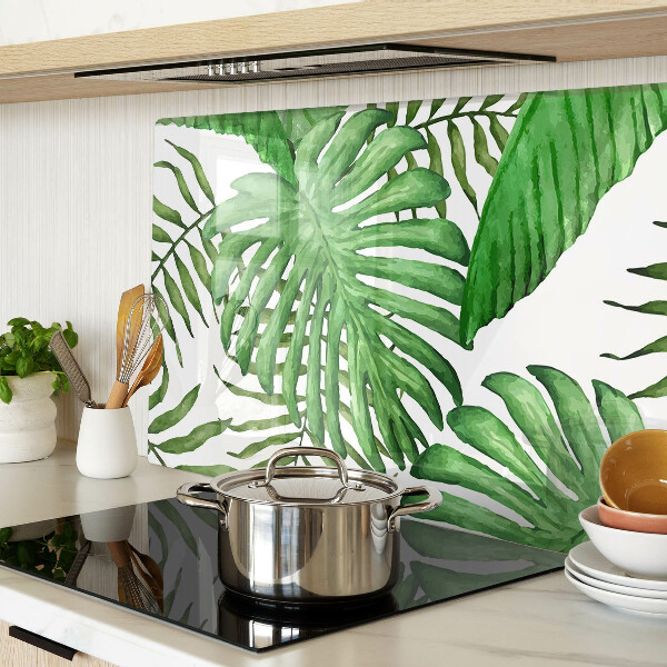 Tabla de cortar de cristal Hojas tropicales en tonos verdes.