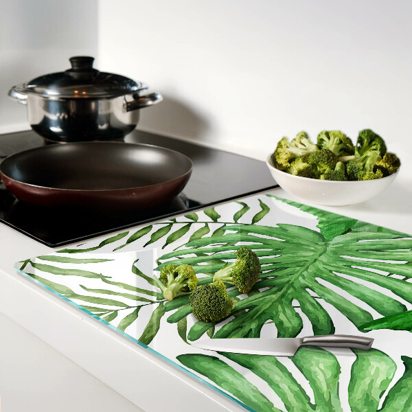 Tabla de cortar de cristal Hojas tropicales en tonos verdes.