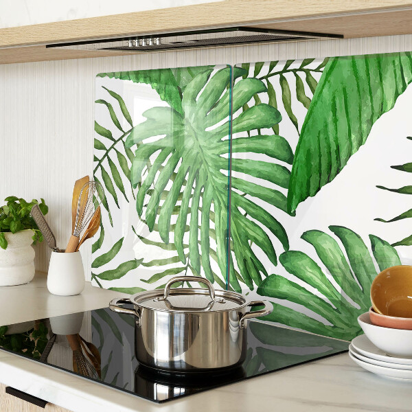 Tabla de cortar de cristal Hojas tropicales en tonos verdes.