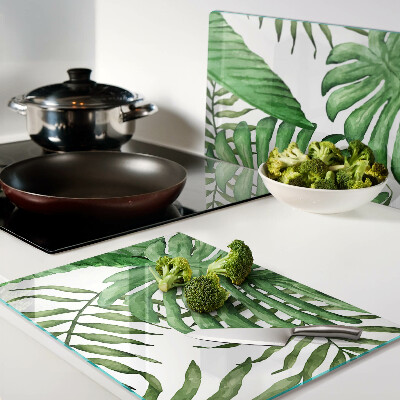 Tabla de cortar de cristal Hojas tropicales en tonos verdes.