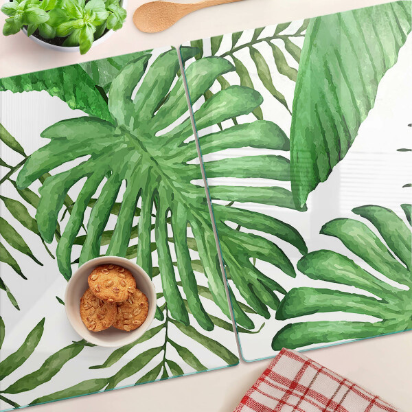 Tabla de cortar de cristal Hojas tropicales en tonos verdes.