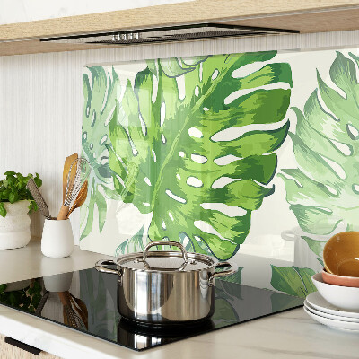 Tabla de cocina Hojas de monstera sobre un fondo claro