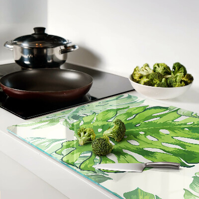 Tabla de cocina Hojas de monstera sobre un fondo claro