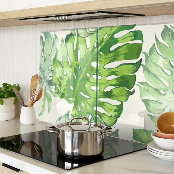 Tabla de cocina Hojas de monstera sobre un fondo claro