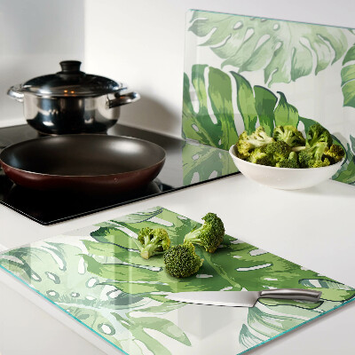 Tabla de cocina Hojas de monstera sobre un fondo claro