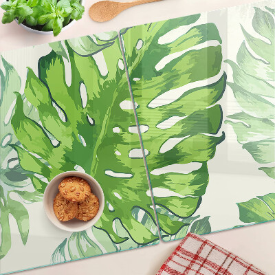 Tabla de cocina Hojas de monstera sobre un fondo claro