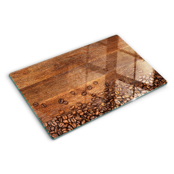 Tabla de cocina Granos de café sobre un fondo de madera