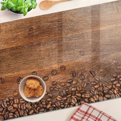 Tabla de cocina Granos de café sobre un fondo de madera