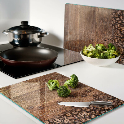 Tabla de cocina Granos de café sobre un fondo de madera