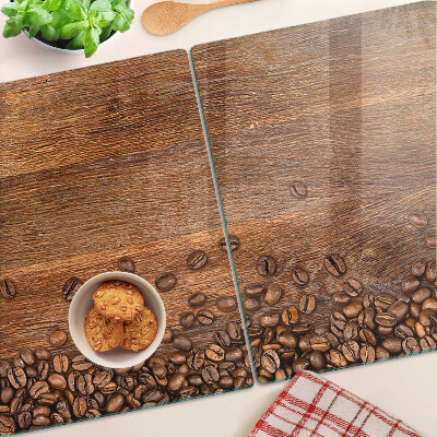 Tabla de cocina Granos de café sobre un fondo de madera