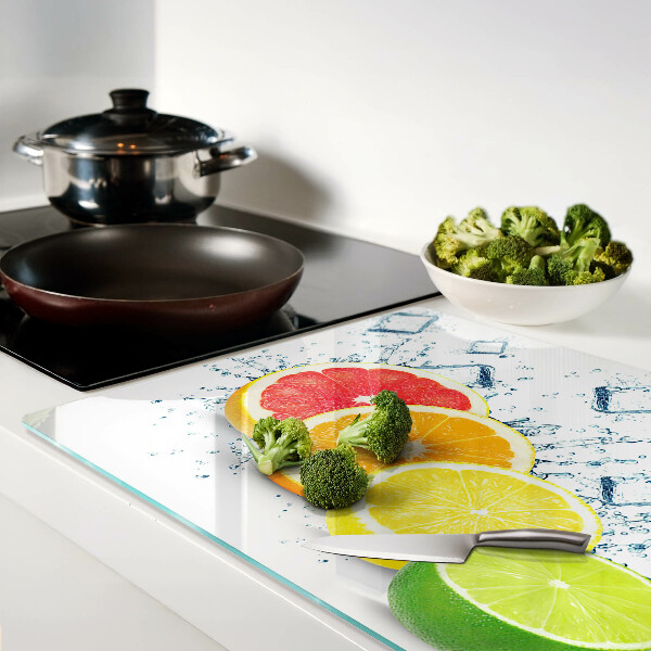 Tabla de cortar de cristal Frutas cítricas en rodajas de colores